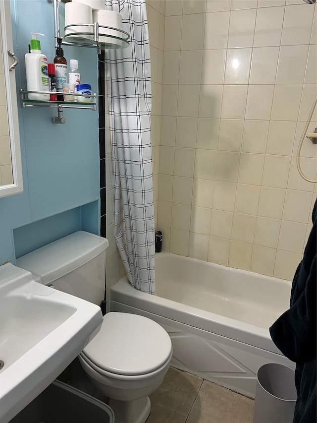 bathroom with toilet, a sink, shower / bath combination with curtain, and tile patterned floors