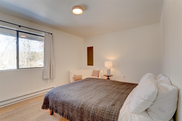 bedroom featuring a baseboard heating unit