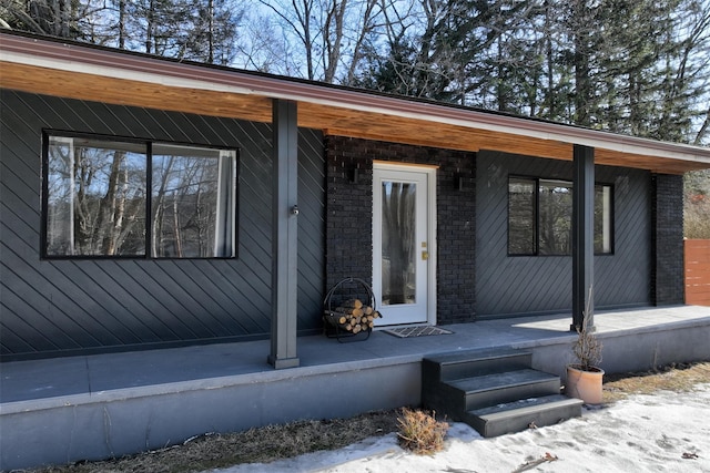property entrance with covered porch
