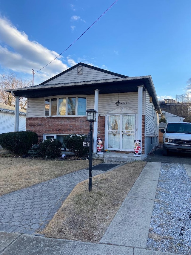 view of front of house with brick siding