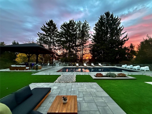 view of home's community featuring a yard, a swimming pool, and a patio area