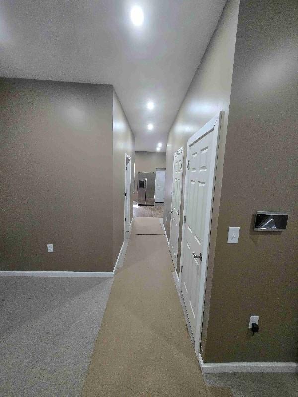 52 Lander St, Newburgh, NY 12550 - corridor with light colored carpet and baseboards