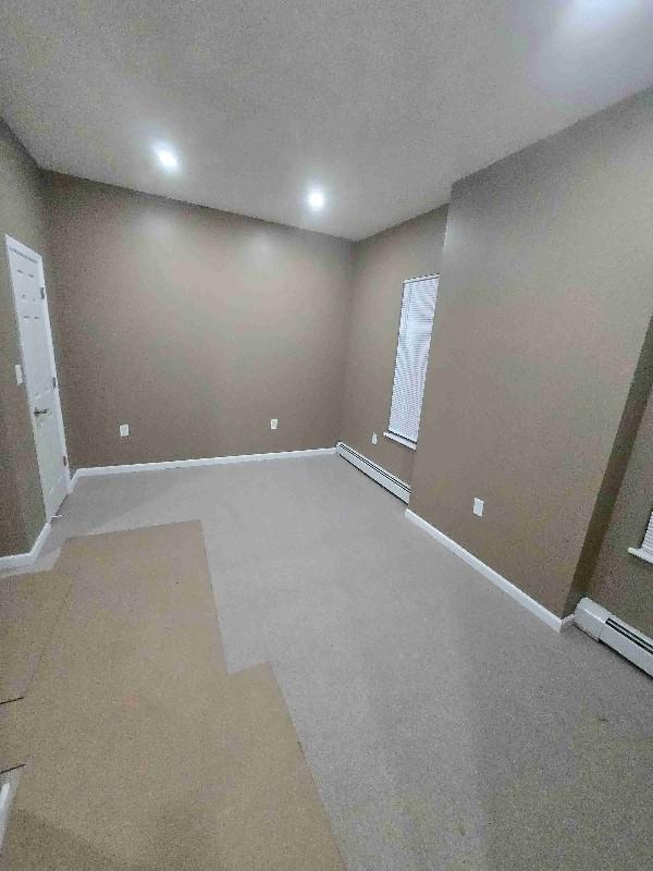 52 Lander St, Newburgh, NY 12550 - below grade area featuring baseboards and a baseboard radiator
