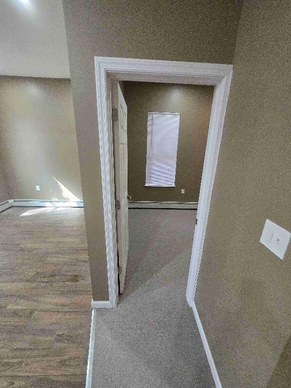 52 Lander St, Newburgh, NY 12550 - details with baseboards and wood finished floors