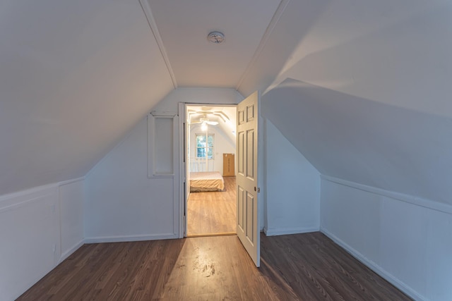 additional living space with lofted ceiling and wood finished floors