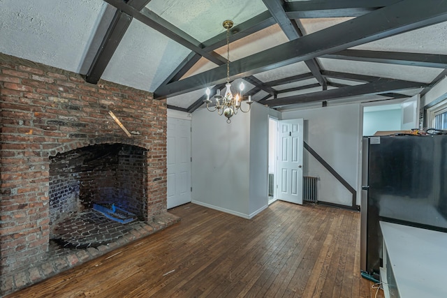 unfurnished living room featuring vaulted ceiling with beams, wood-type flooring, baseboards, and a chandelier