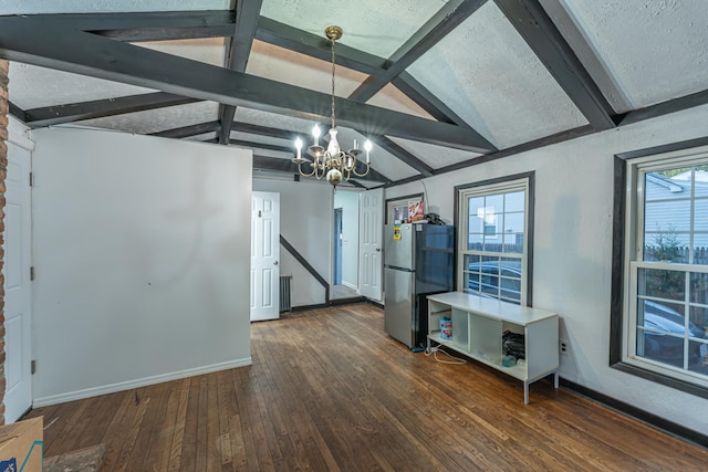 interior space with a chandelier, baseboards, vaulted ceiling with beams, and hardwood / wood-style floors