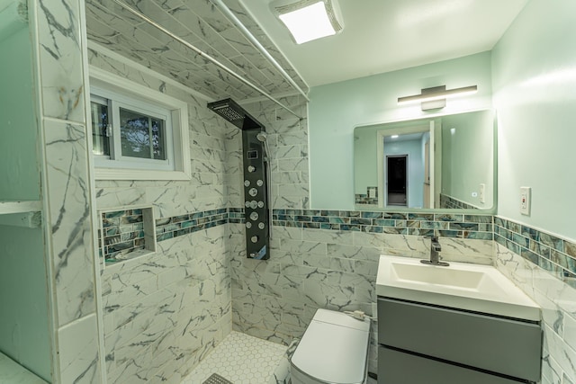 full bath featuring toilet, tile walls, tiled shower, and vanity