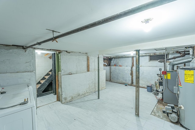 unfinished basement with washer / dryer