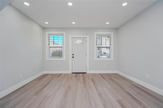 entrance foyer featuring recessed lighting, baseboards, and light wood finished floors