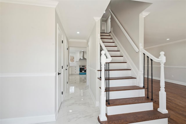 staircase featuring recessed lighting, baseboards, marble finish floor, and ornamental molding