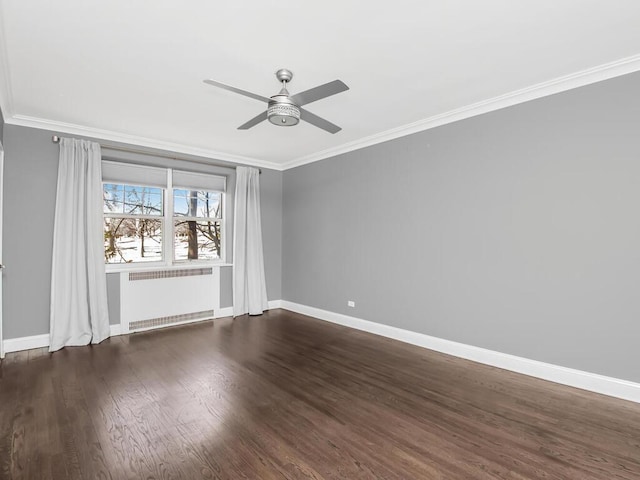 unfurnished room with dark wood-style floors, crown molding, radiator heating unit, ceiling fan, and baseboards