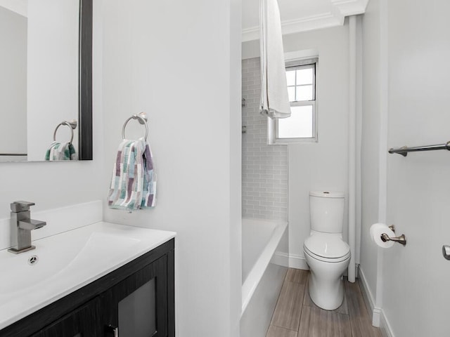 full bathroom with toilet, vanity, baseboards, and wood finish floors