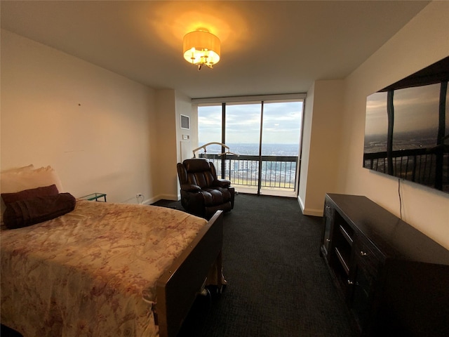 bedroom featuring floor to ceiling windows, visible vents, dark carpet, access to outside, and baseboards