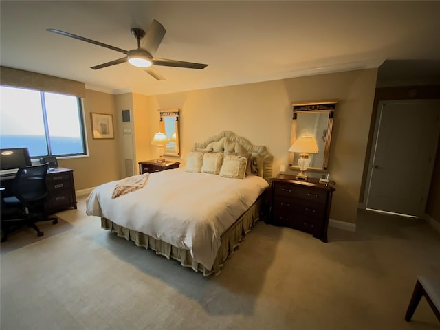 bedroom with light carpet, baseboards, a ceiling fan, and ornamental molding