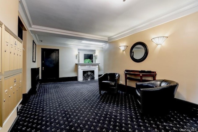 interior space featuring mail area, a fireplace, baseboards, and ornamental molding