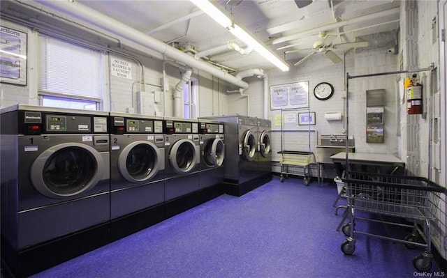 common laundry area featuring washer and dryer and a ceiling fan