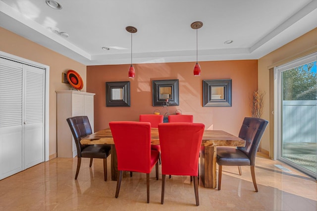 dining space with a tray ceiling, visible vents, and recessed lighting