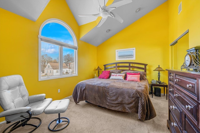 bedroom with carpet floors, visible vents, high vaulted ceiling, and a ceiling fan