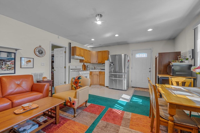 living room with recessed lighting and visible vents