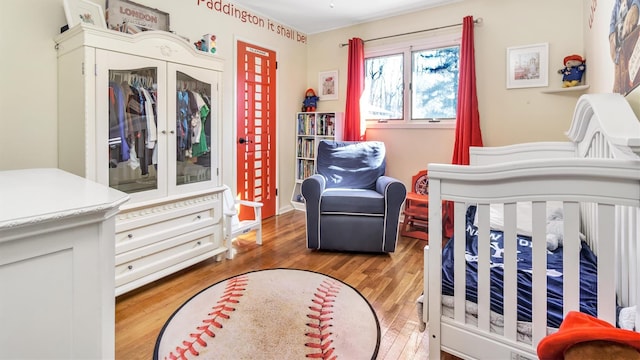 bedroom with wood finished floors