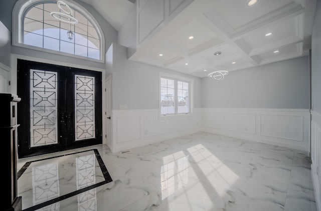 foyer featuring marble finish floor, french doors, beamed ceiling, and recessed lighting