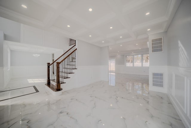 unfurnished living room featuring marble finish floor, visible vents, a decorative wall, and stairway