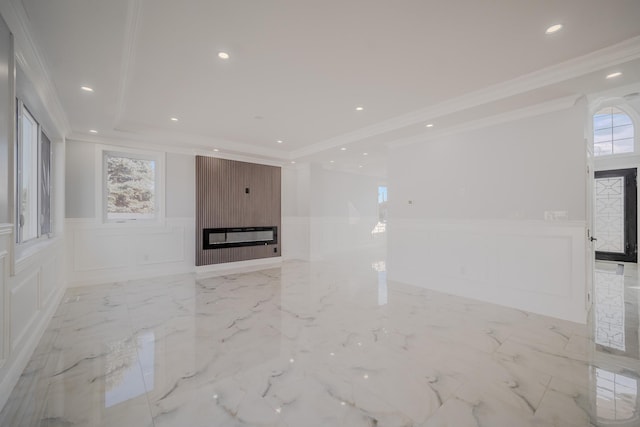 unfurnished living room featuring recessed lighting, a wainscoted wall, a decorative wall, a fireplace, and marble finish floor