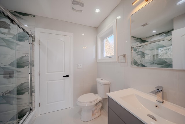 bathroom with a marble finish shower, visible vents, vanity, and toilet