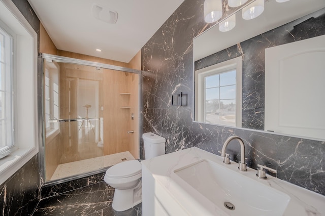 full bathroom with toilet, marble finish floor, tile walls, and a stall shower