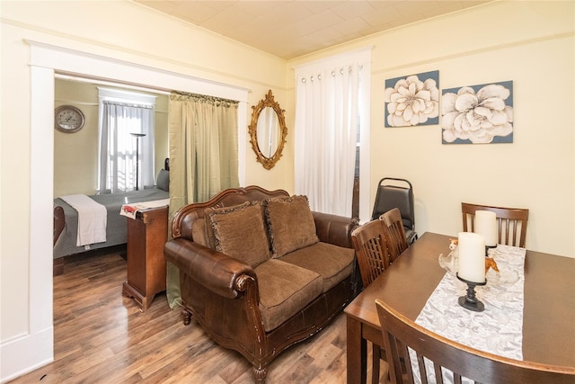 living room featuring ornamental molding and wood finished floors