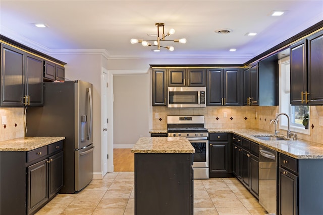 kitchen with crown molding, visible vents, appliances with stainless steel finishes, a sink, and light stone countertops