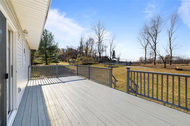 wooden terrace with a yard