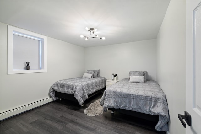 bedroom featuring a baseboard radiator, wood finished floors, and a notable chandelier