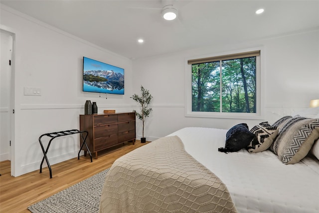 bedroom with light wood-type flooring and recessed lighting