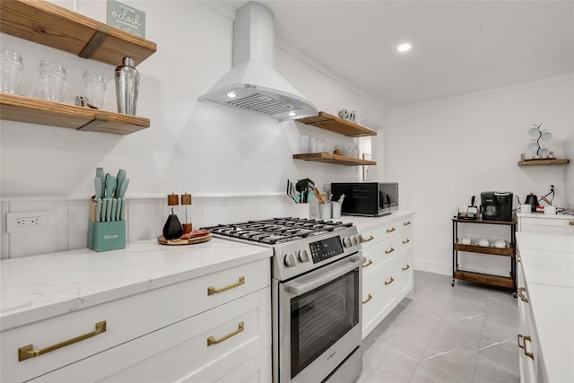 kitchen with light stone counters, white cabinets, appliances with stainless steel finishes, range hood, and open shelves