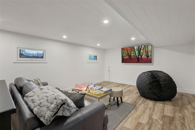 living area with recessed lighting, baseboards, and wood finished floors