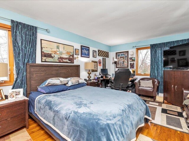 bedroom with wood finished floors