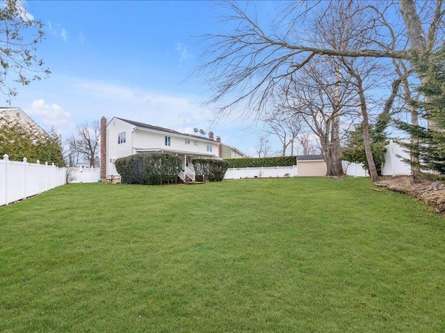 view of yard with a fenced backyard