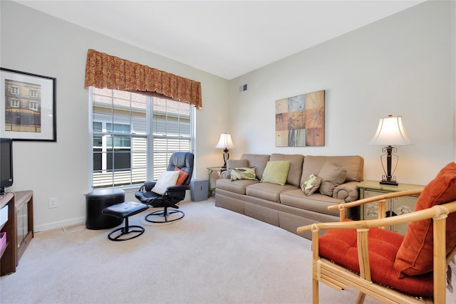 carpeted living area with visible vents and baseboards