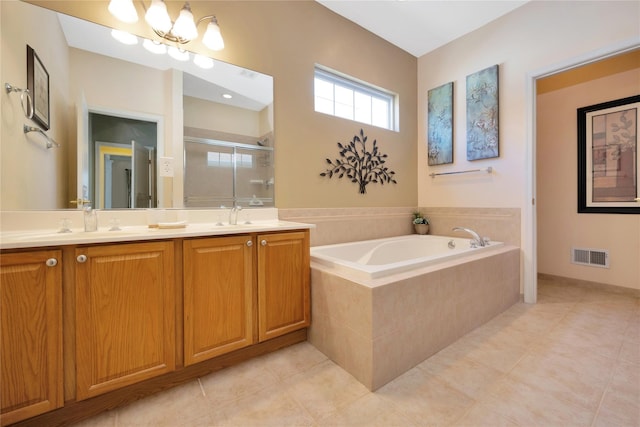 full bathroom featuring double vanity, visible vents, a garden tub, a shower stall, and a sink