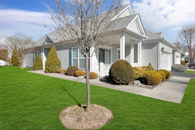 view of property exterior featuring a garage, a porch, and a lawn