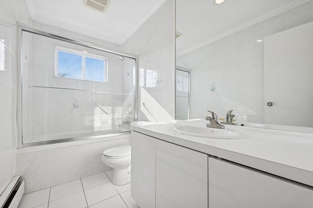 full bathroom with toilet, ornamental molding, a baseboard heating unit, tiled shower / bath combo, and tile patterned flooring