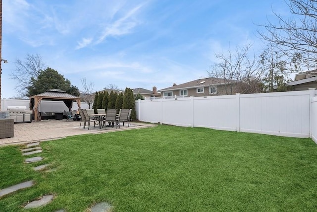 view of yard with a gazebo, a patio area, and a fenced backyard