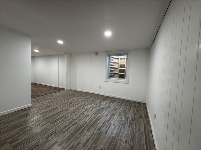below grade area featuring recessed lighting, baseboards, and wood finished floors