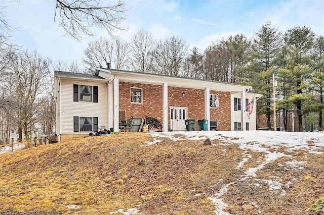 view of front of house with french doors and brick siding