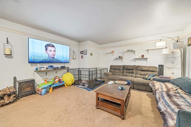 living area featuring carpet flooring and a wood stove