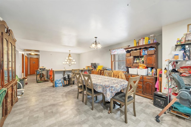 dining area with a notable chandelier