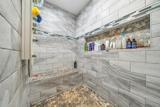 full bathroom with a tile shower