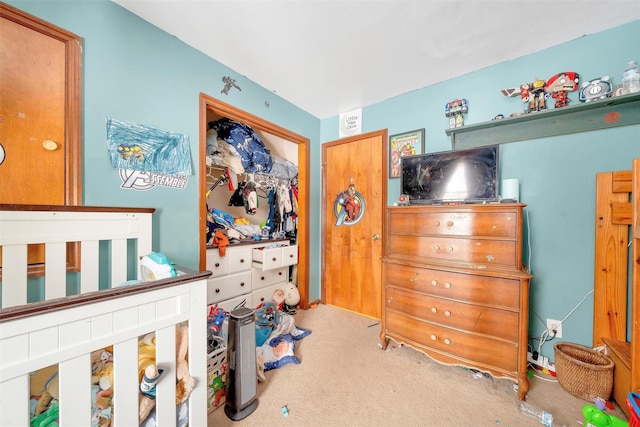 carpeted bedroom with a closet